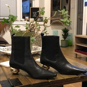 Black boots with gold ball heel